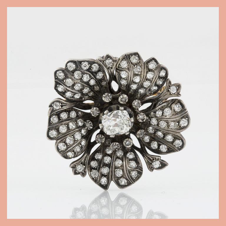 A Victorian old- and rose-cut diamond brooch. Circa 1860. Center diamond circa 1.50 cts.