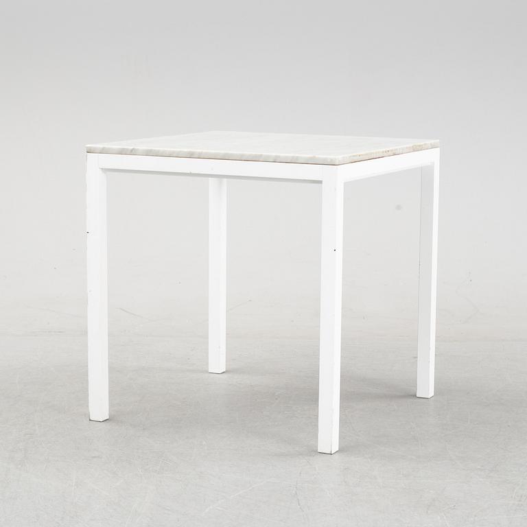 A marble top table, 21th century.