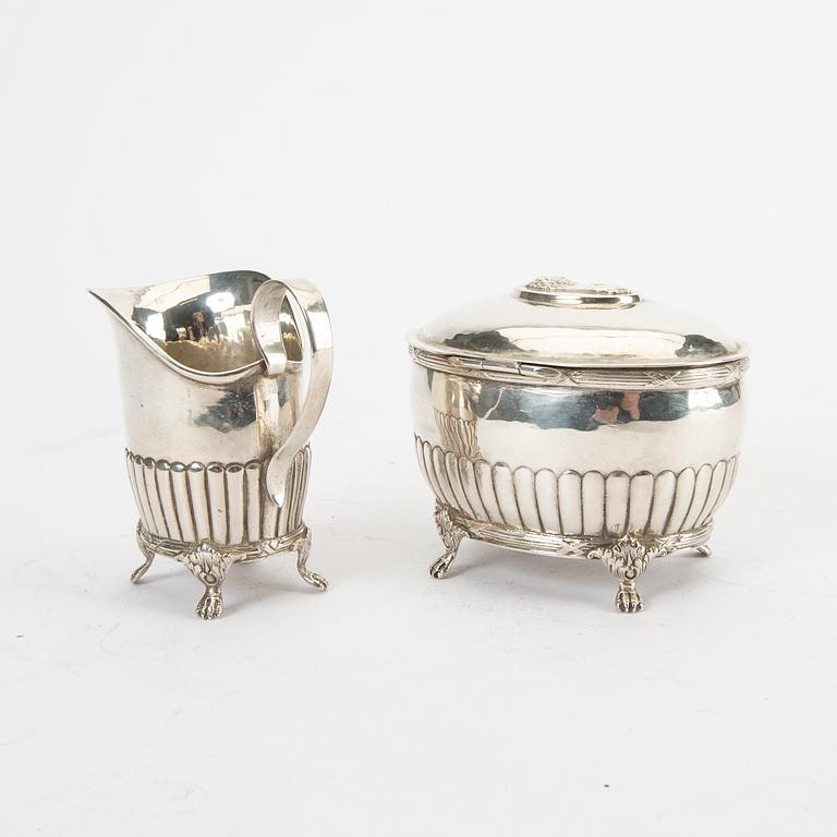 A 20th century silver creamer and sugar bowl weight 310 grams.