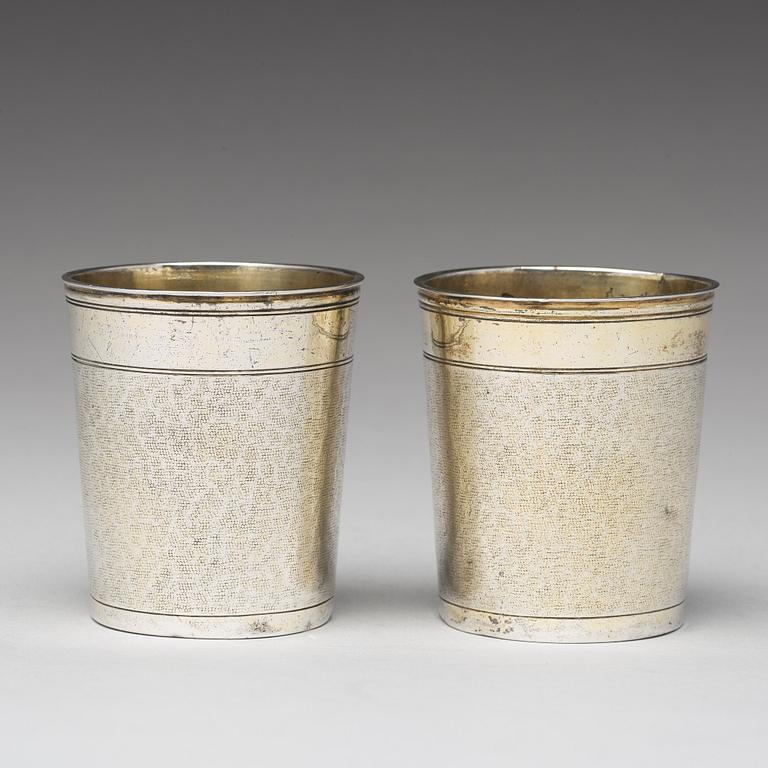 A matched pair of German 17th century parcel-gilt silver, Augsburg (1627-1665).