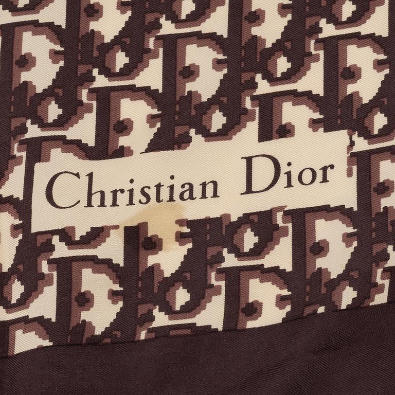 Christian Dior, a clutch, coin purse, key holder and silk scarf.