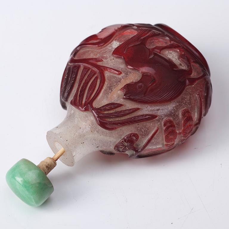 A peking glass snuff bottle with stopper, Qing dynasty, 19th Century.