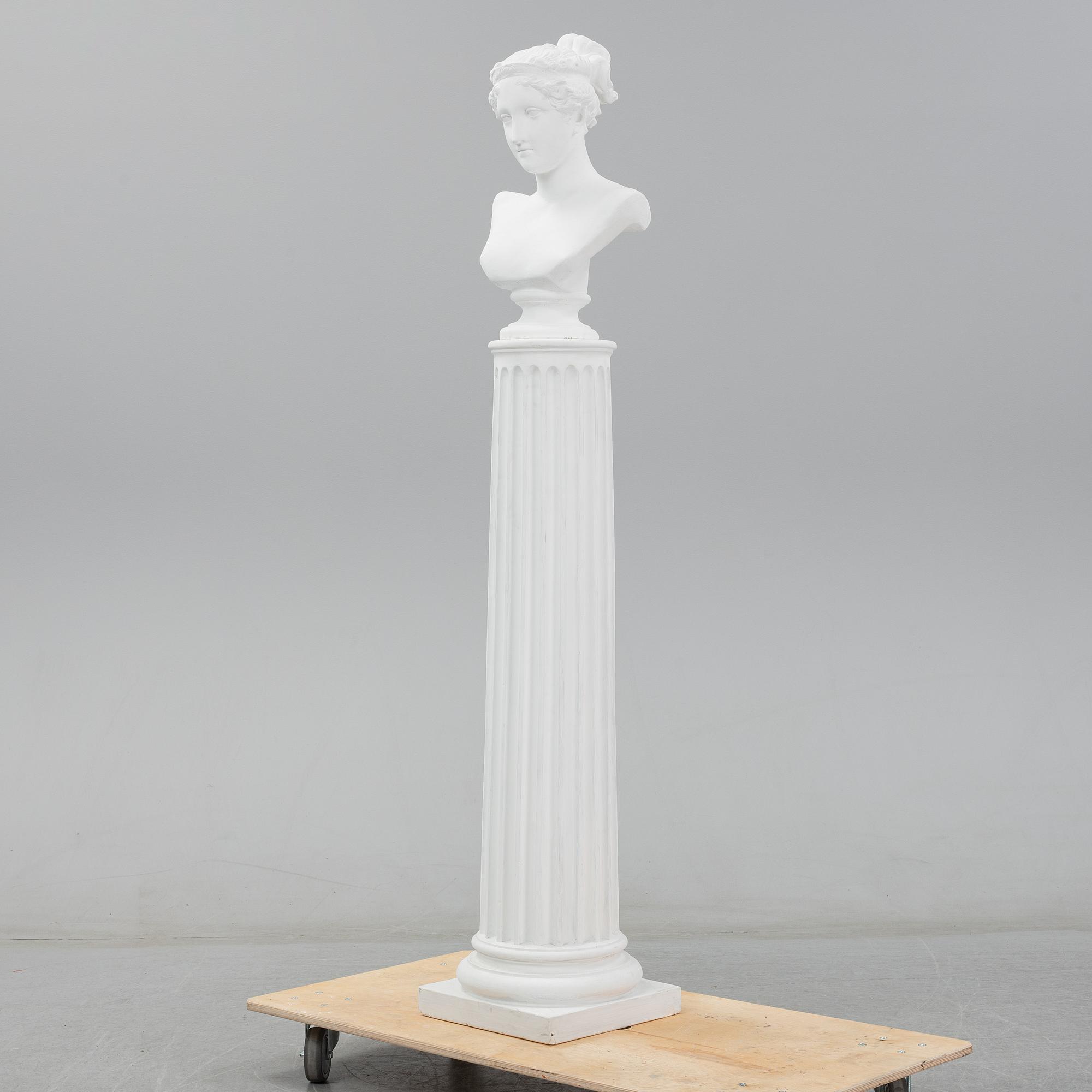 A plaster bust and pedestal.