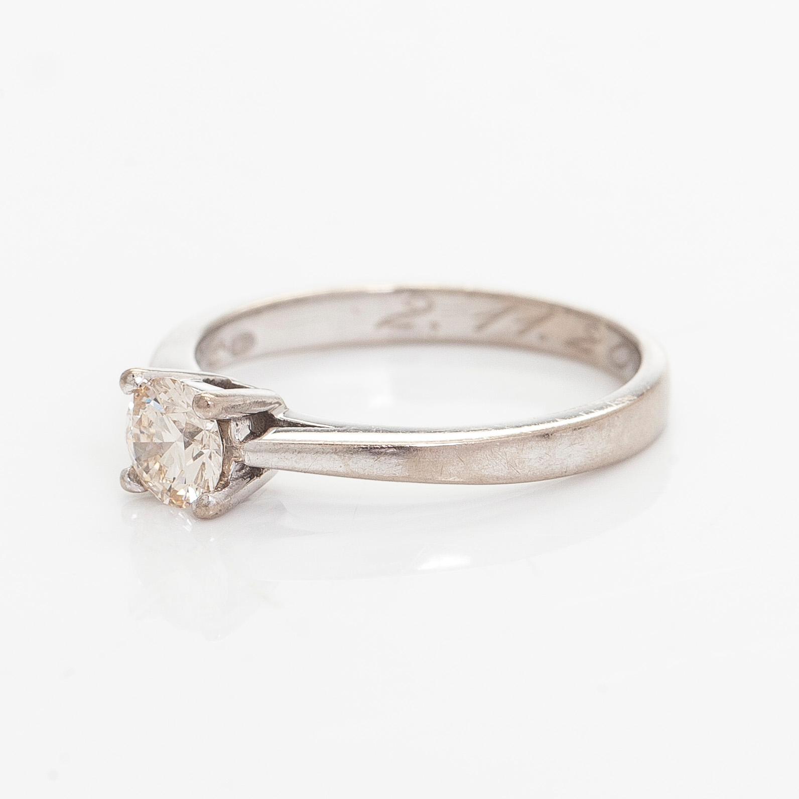 Ring, brilliant cut diamond, 14K white gold.