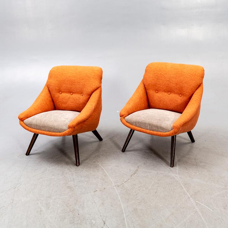 A pair of 1950s easy chairs.