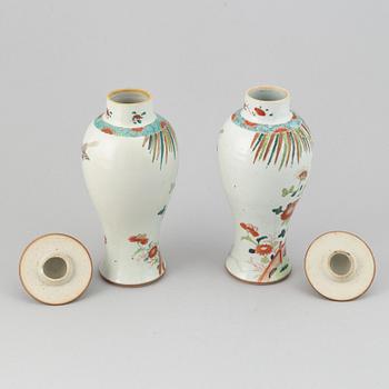 A pair of famille rose vases with covers, Qing dynasty, Qianlong (1736-95).