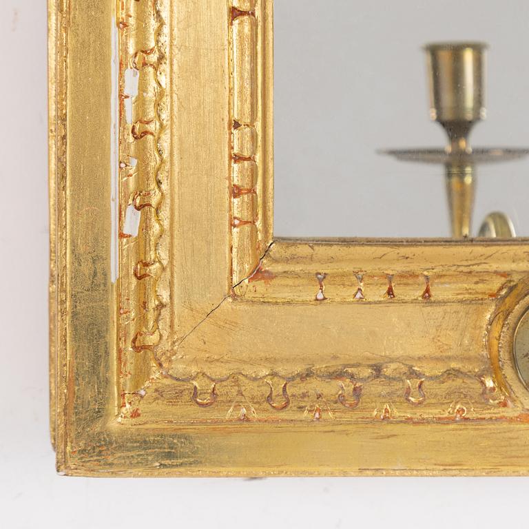 A "Meunier" mirror wall lamp from IKEA's 18th-century series, late 20th century.