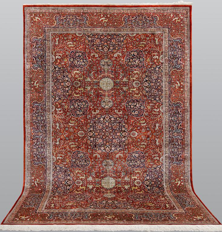A pictoral orietal silk rug, 246 x 153 cm.
