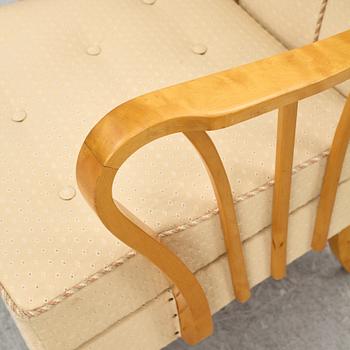 A pair of 1940s Swedish Modern armchairs.