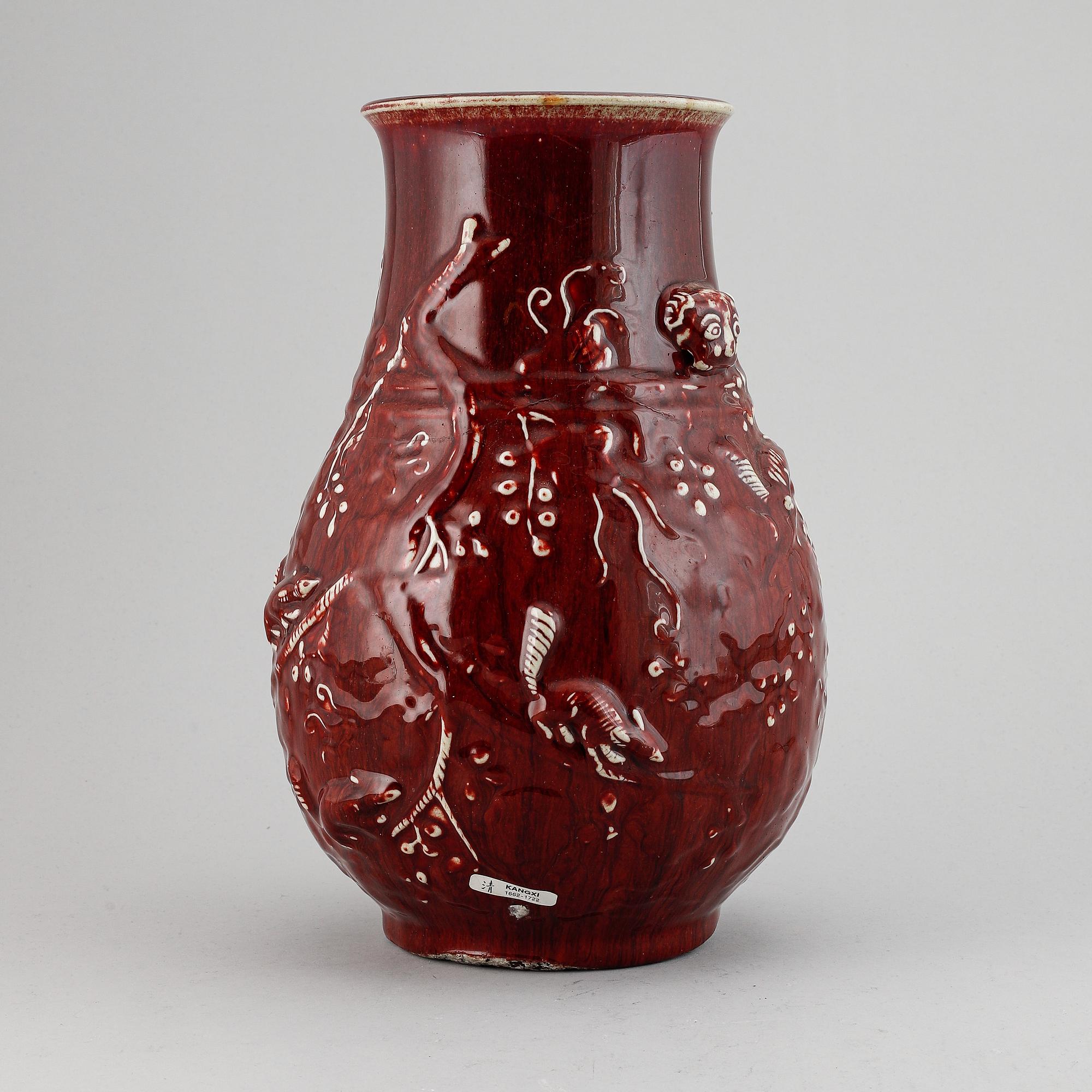 A red glazed Chinese vase, 20th century.