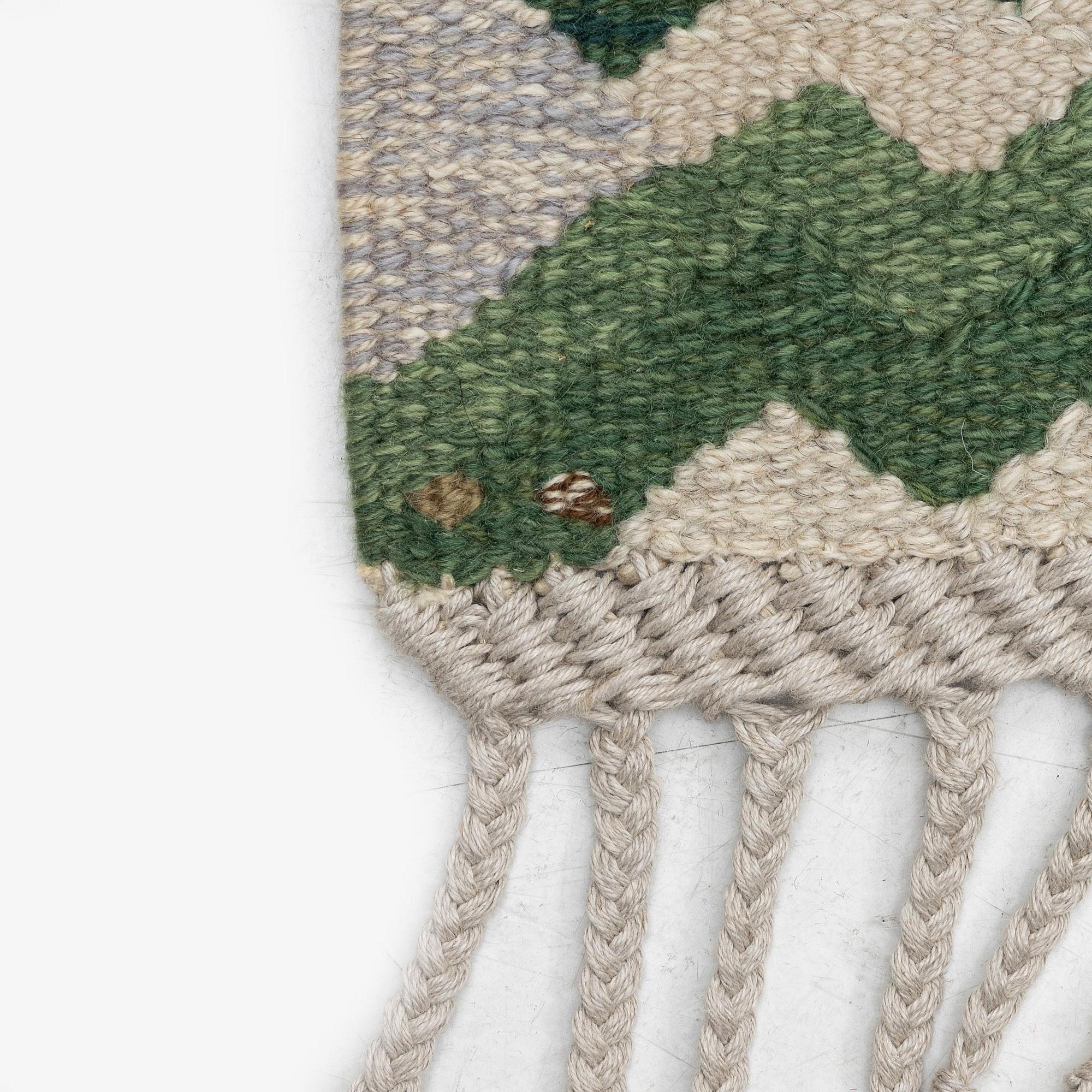 Barbro Nilsson, a carpet, 'Strålblomman grön', tapestry weave, c. 316 x 232 cm, signed AB MMF BN.