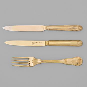 221. An early 19th century silver-gilt 24 piece table cutlery, mark of P Zethelius and G Folcker, Sthlm 1806 and 1826.