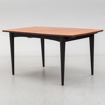 A 1950s/1960s teak and teak veneer table.