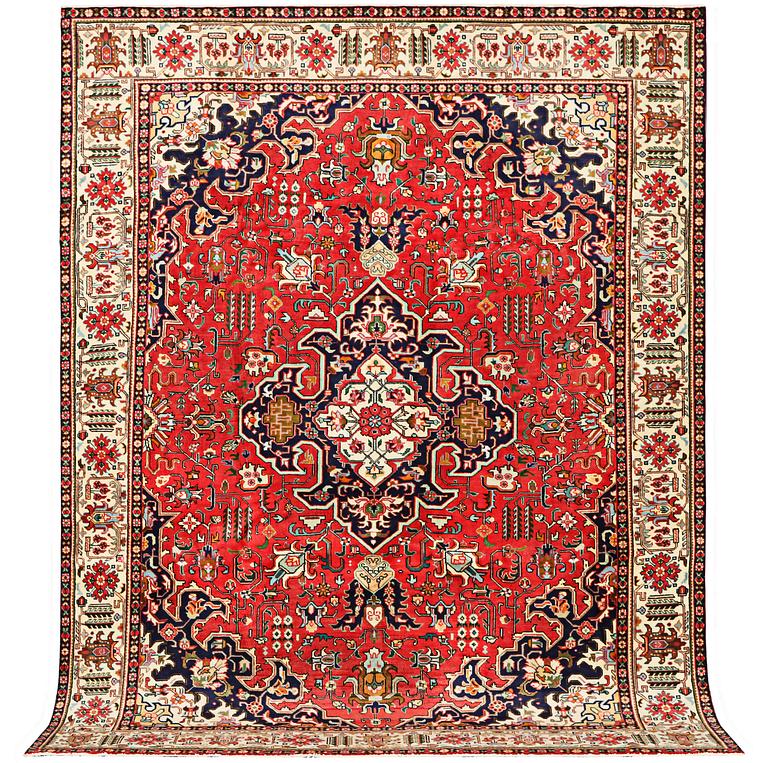 A Tabriz carpet, c. 335 x 257 cm.