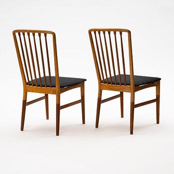 A pair of Scandinavian Mid Century Modern teak, oak and elm chairs.