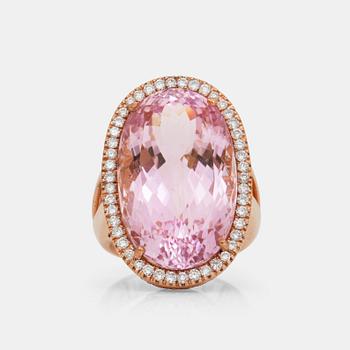 732. A kunzite, circa 30.00 ct, and diamond, circa 1.10 ct, ring.