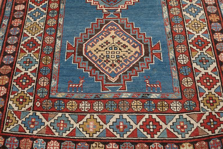 A RUNNER, a semi-antique Caucasian, ca 303,5 x 129,5-140,5 cm (as well as one end with 2,5 cm flat weave).