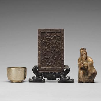 666. A stone placque, a soapstone figure and a cup, late Qing dynasty.