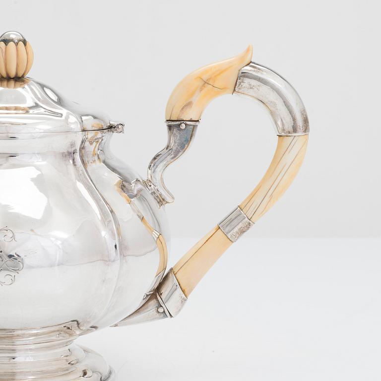 Polish silver teapot and milk jug, maker's mark of Karol Filip Malcz, Warsaw, mid-19th century.