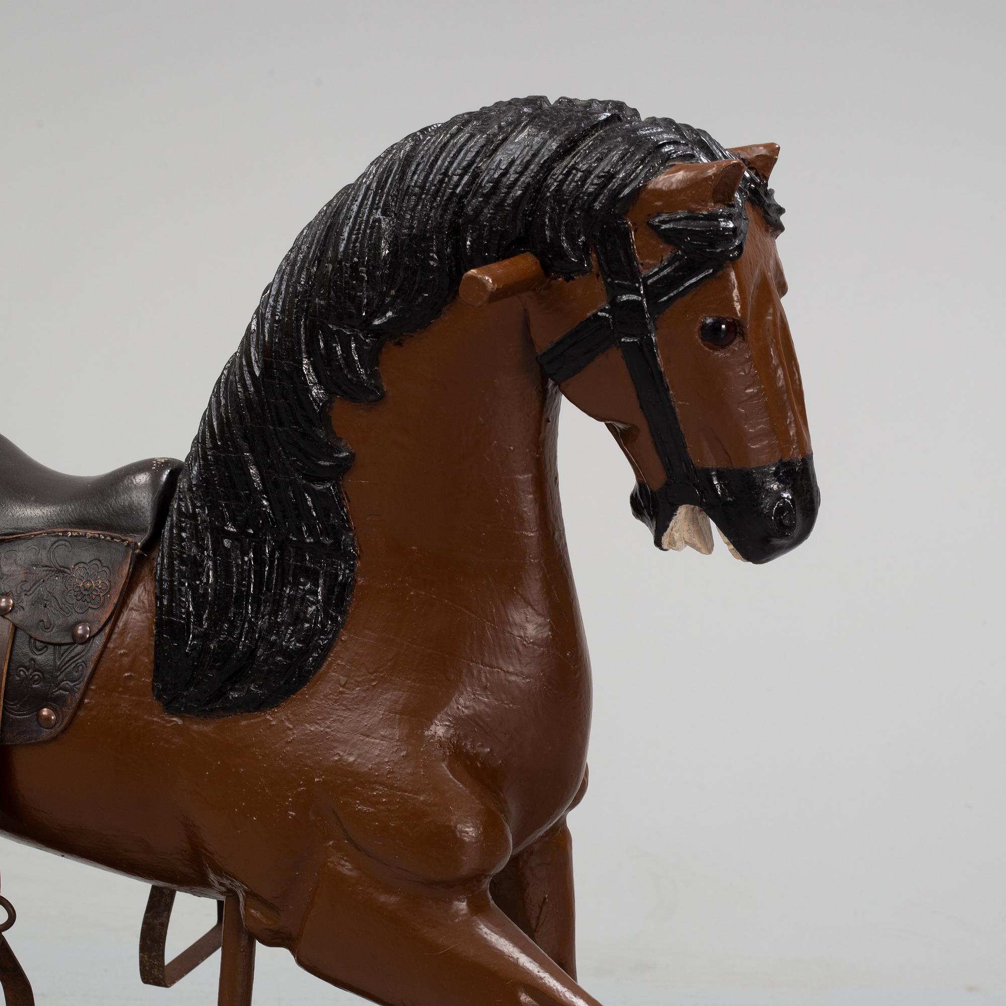 A painted rocking horse from around 1900.