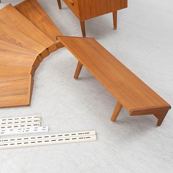 A teak and teak veneered shelf system, mid 20th century.