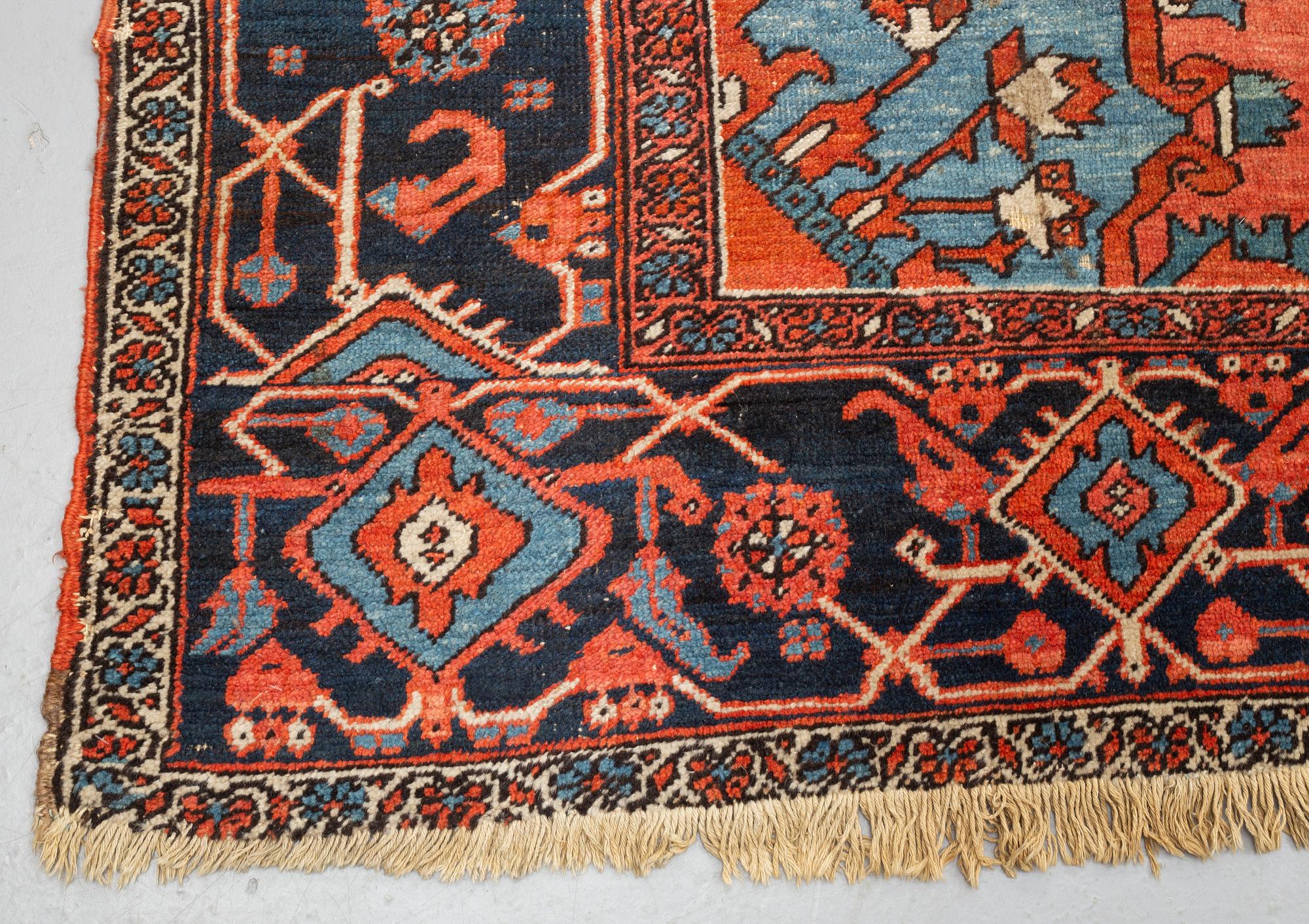 A carpet, an antique Heriz, ca 469,5-471 x 300-309,5 cm.