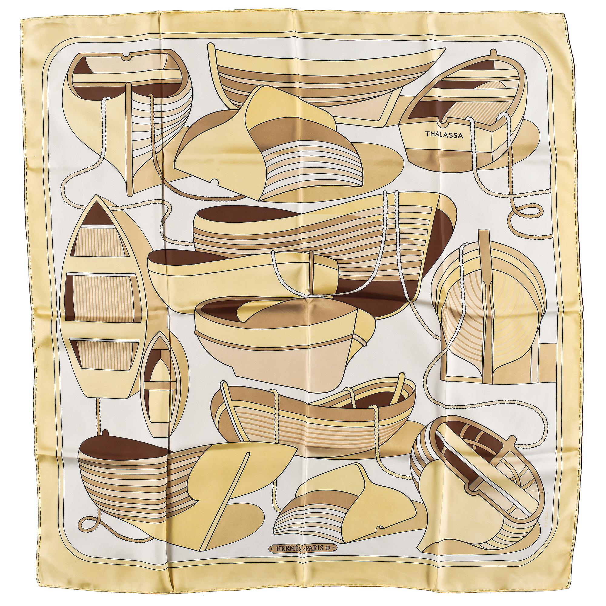 A set of three silk scarves by Hermès, "Etriers" and "Thalassa".