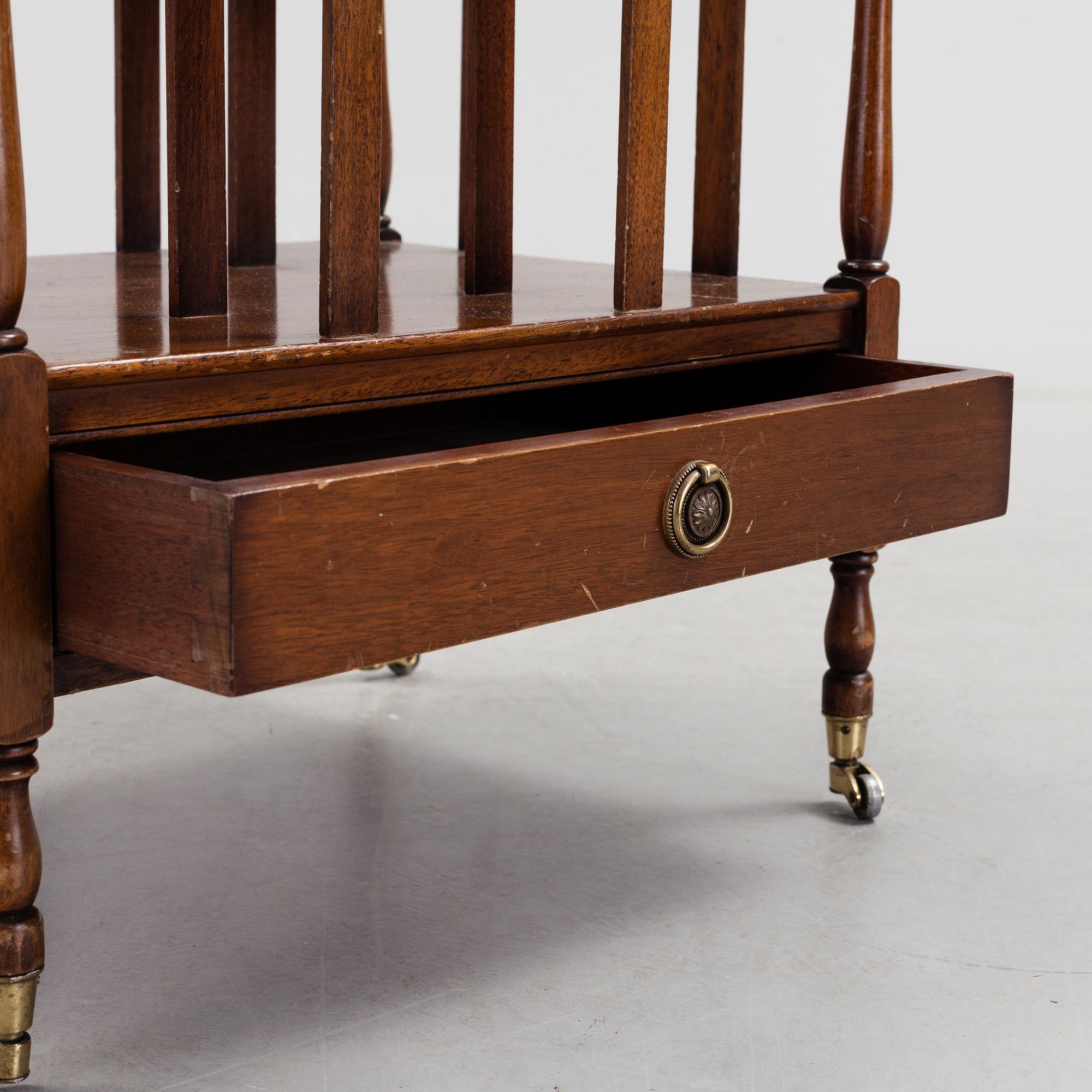 A mahogny newspaper stand (so called Canterbury), England, late 20th century.