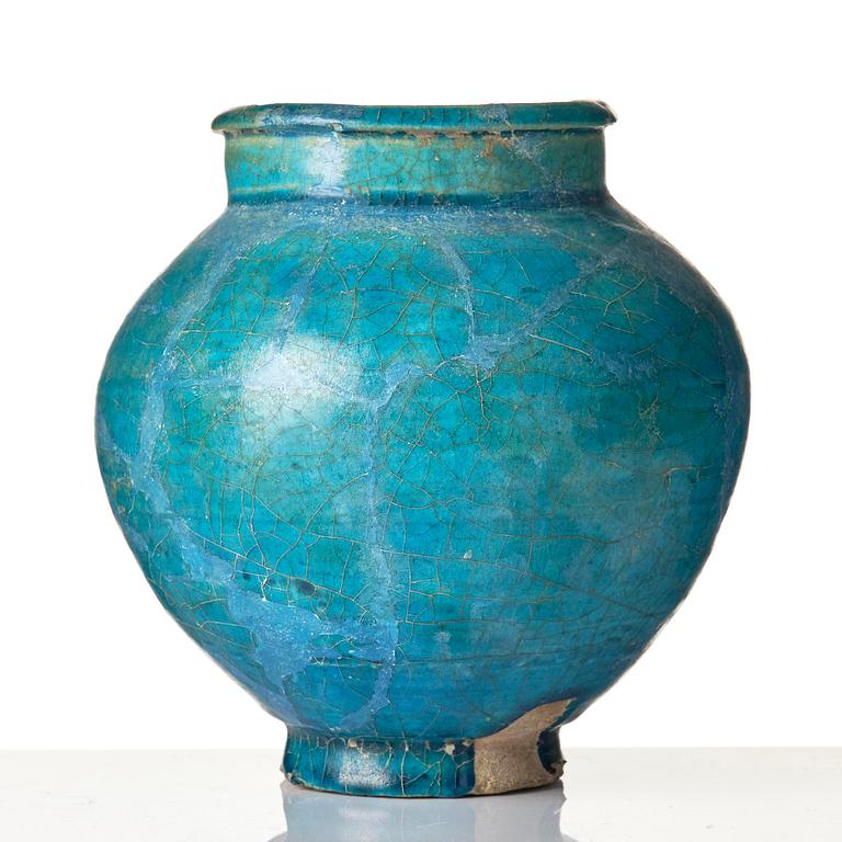 A turquoise Keshan pottery vase, central Persia, 13th century.