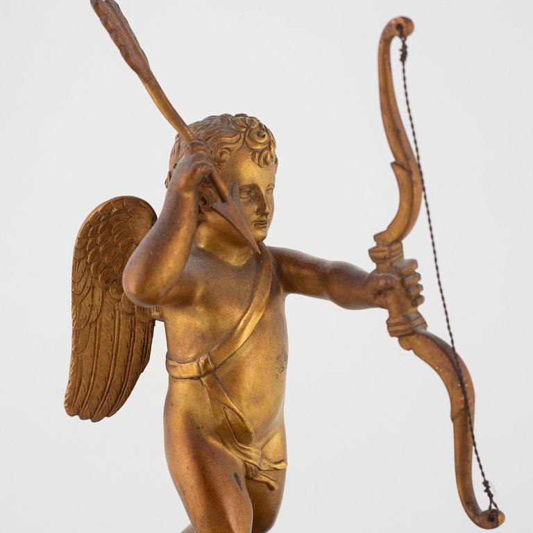 An Empire-style gilt-bronze and verde antico 'Au char de l'Amour' figural mantel clock, late 19th century.