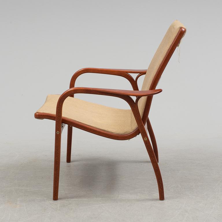 YNGVE EKSTRÖM, a "Kurva" armchair by Swedese.