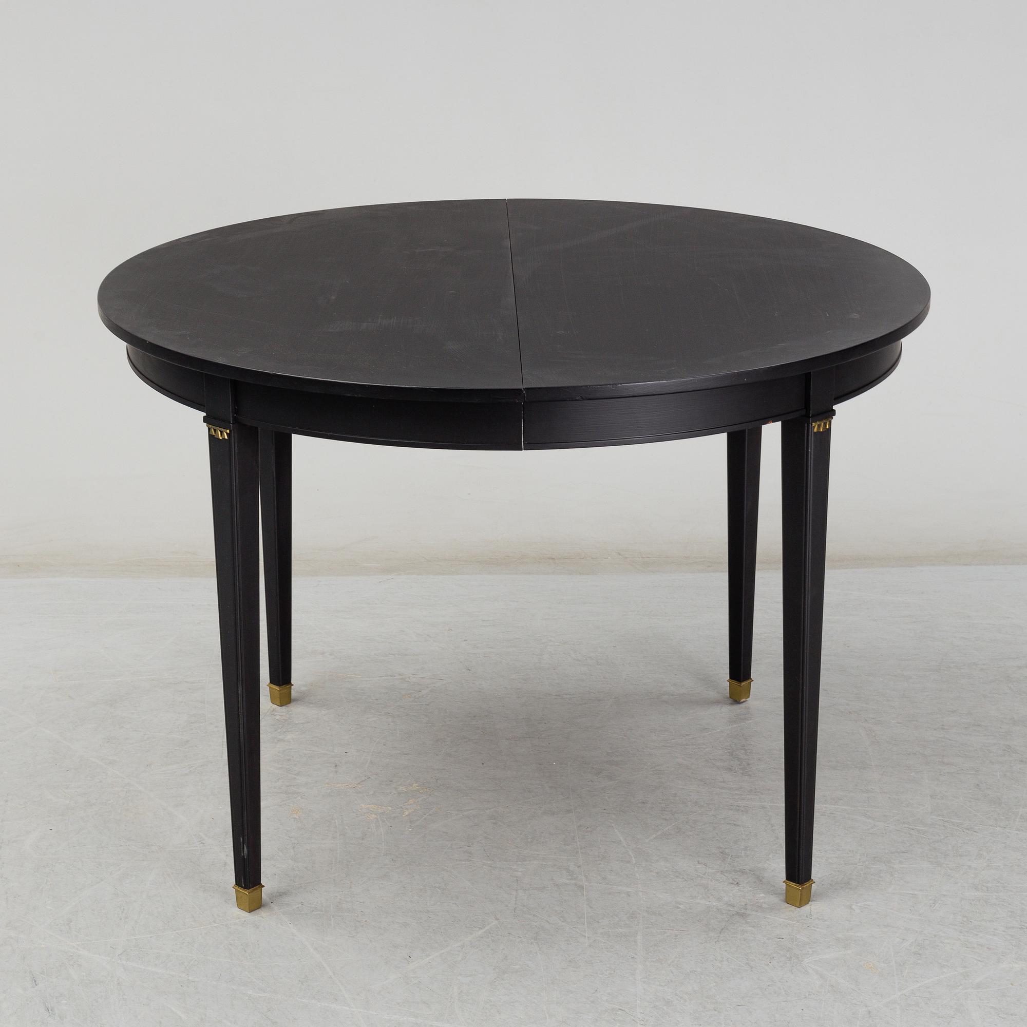 A Gustavian style painted dining table, second half of the 20th century.