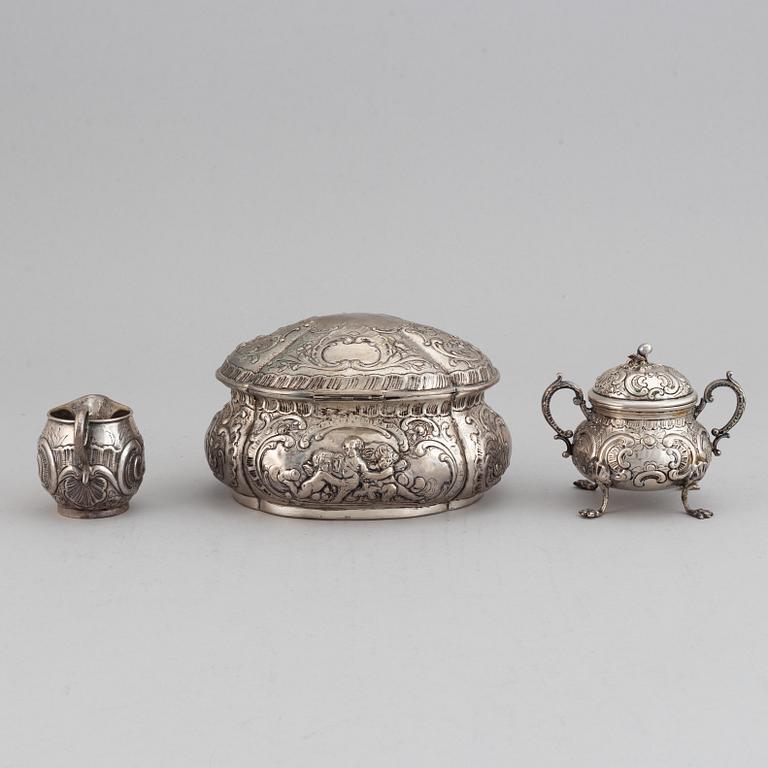 A german silver 800 sugar box, creamer and sugar bowl.