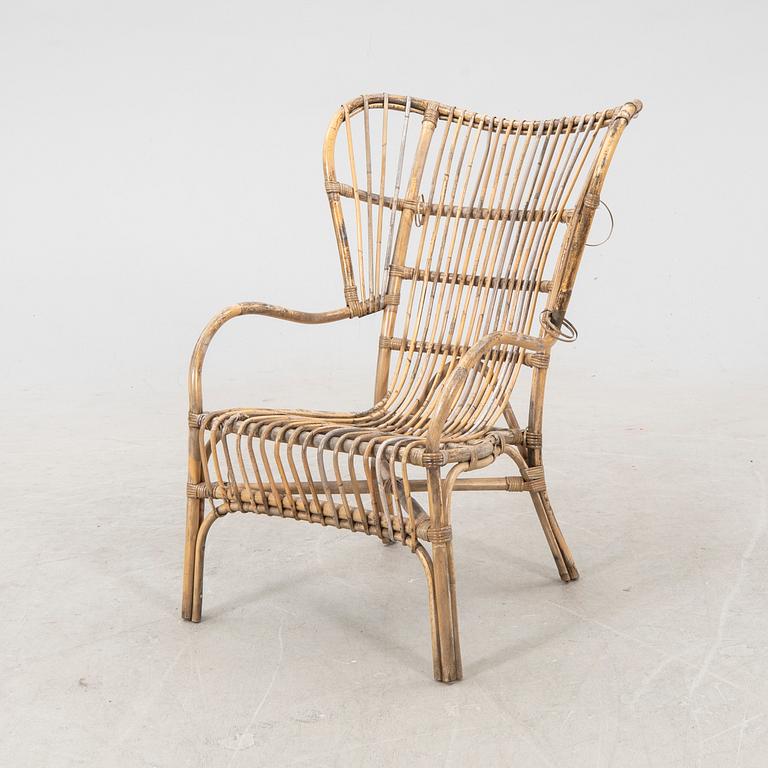 A mid 1900s bamboo and rattan armchair.
