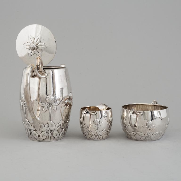 A Danish Arts and crafts sterling silver three piece coffee set, Niels Georg Henriksen for A. Michelsen, 1906 and 1921.