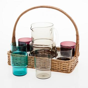 SAARA HOPEA, A glass pitcher and six glasses in rattan basket, for Nuutajärvi. Designed year 1952.