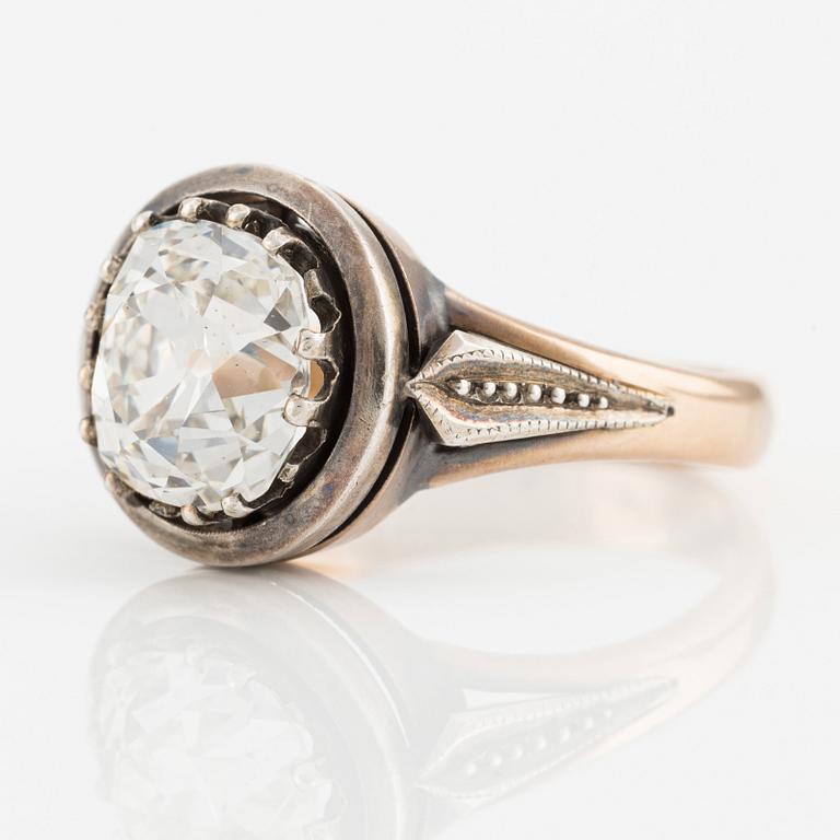 A 14K gold and silver ring with an old-cut diamond.