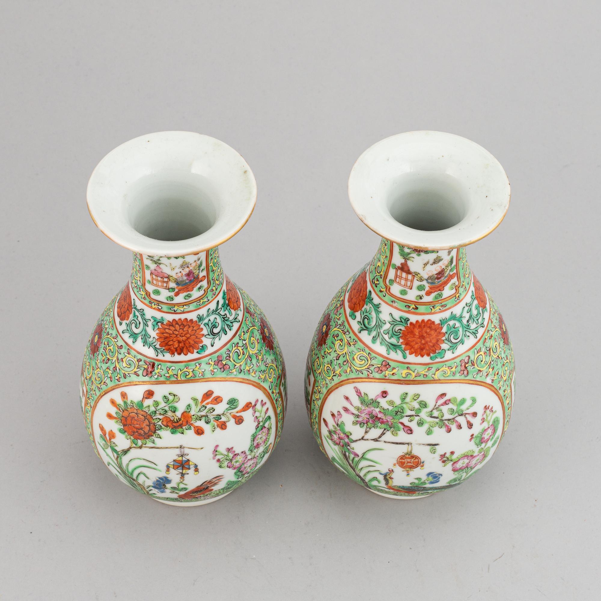 A pair of famille rose canton vases, early 20th century.