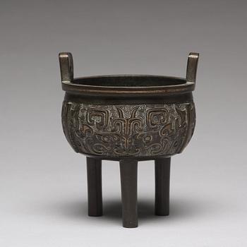 A tripod bronze censer Qing dynasty, 19th Century.