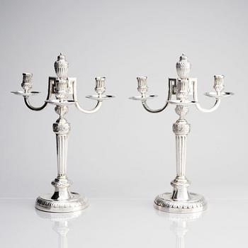 A pair of Austrian Royal, Three-armed silver candelabras, marks of lgnaz Joseph Würth, Vienna 1779.