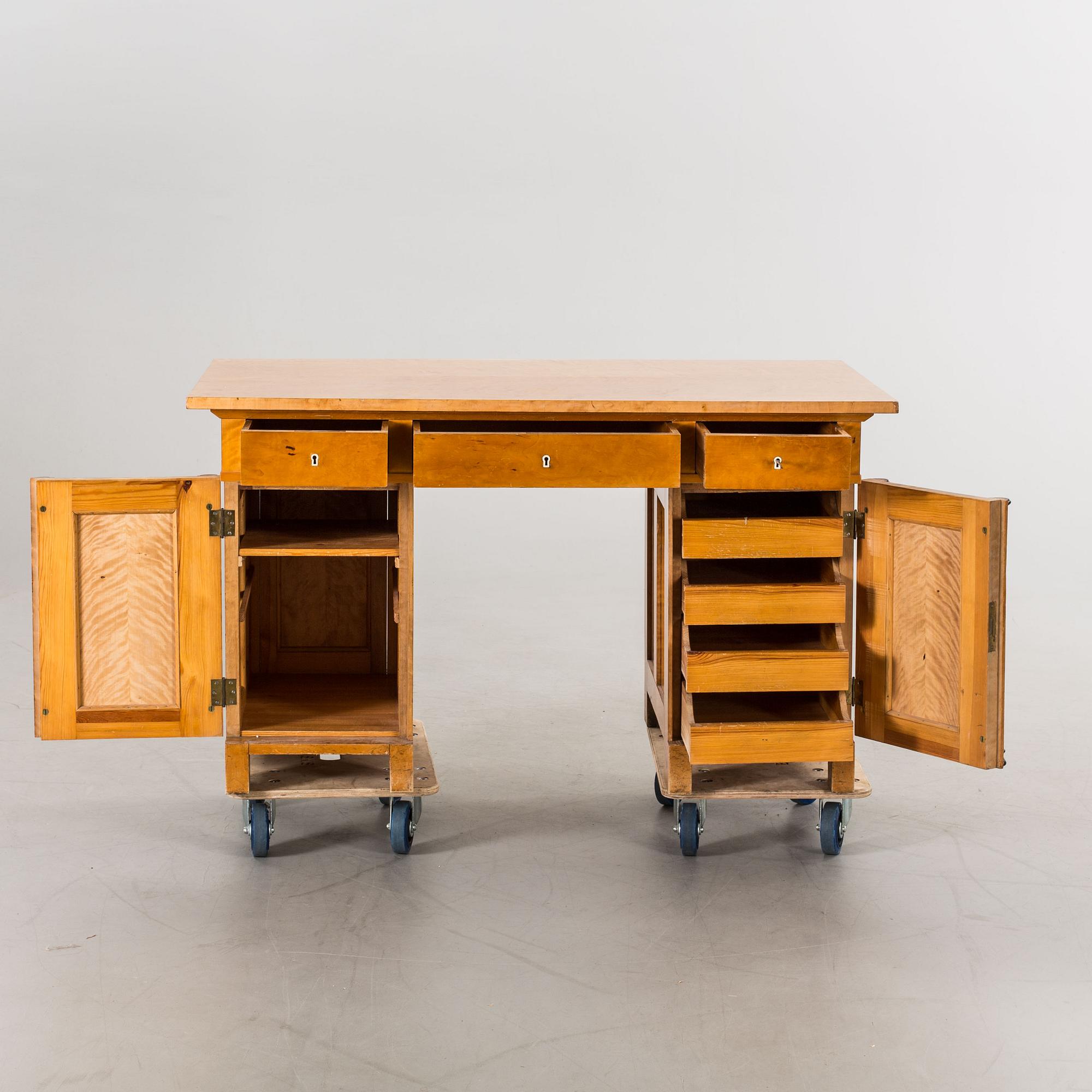 An early 20th century Karl Johan style birch writing table.