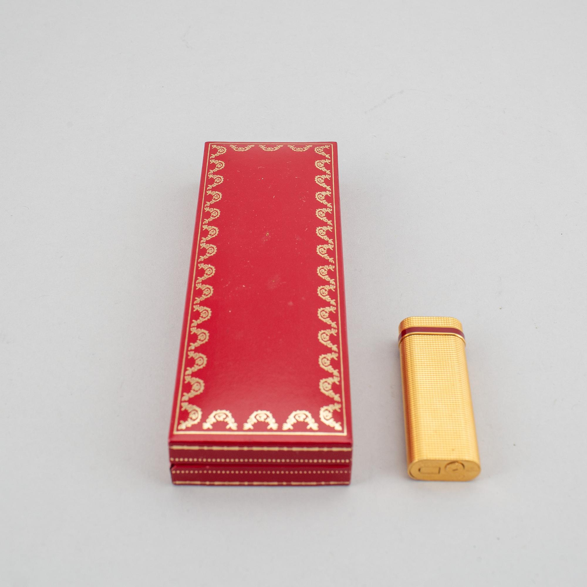 A Cartier lighter and pen.
