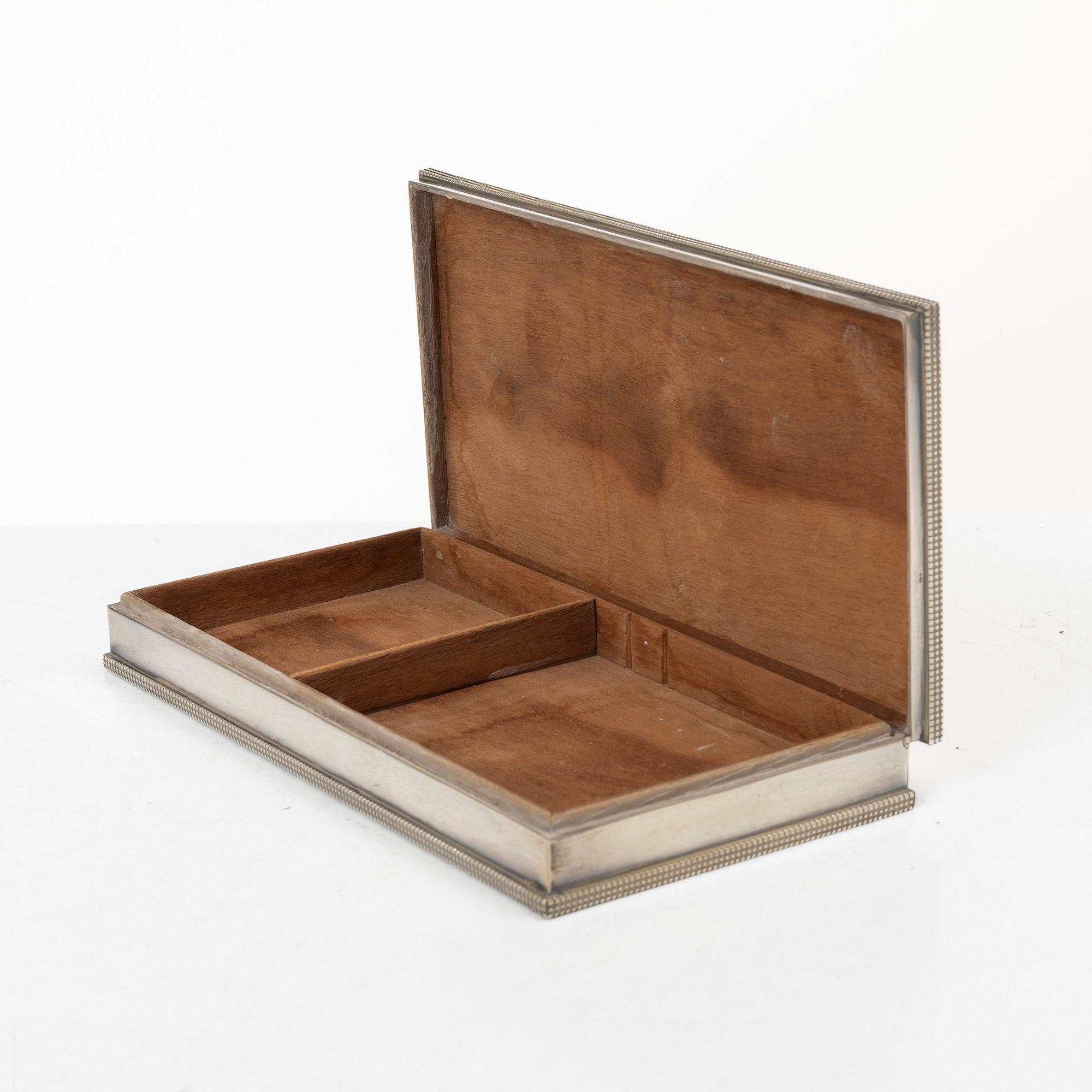 A sterling silver cigarette box with Swedish import marks, presumably mid 20th century.