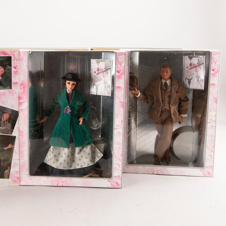 A set of four 1990s Barbie and Ken dolls Mattel.