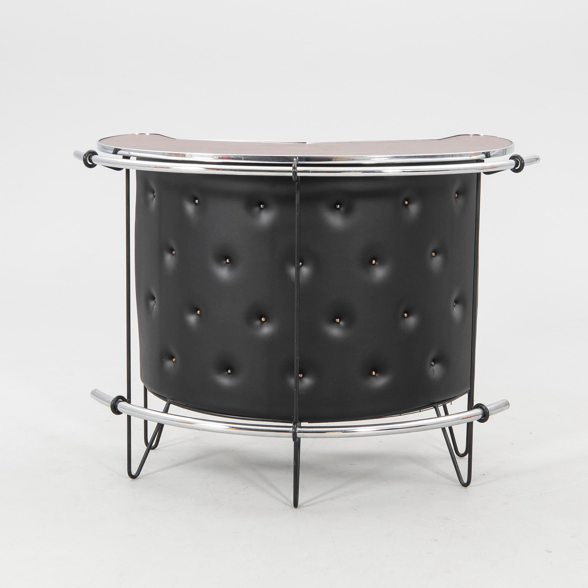 A 1970s bar and four stools.