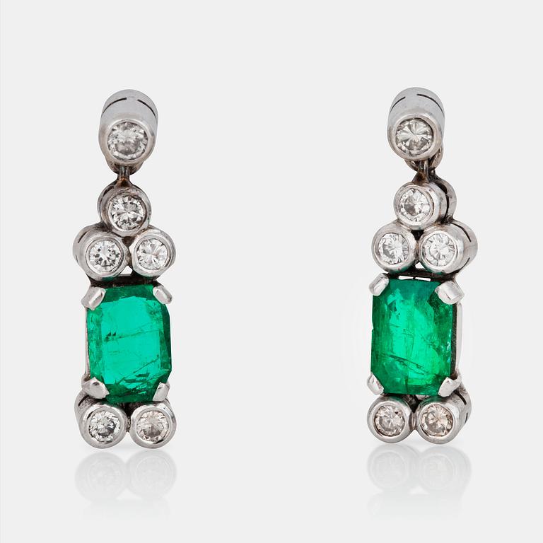 A pair of emerald and brilliant-cut diamond earrings.