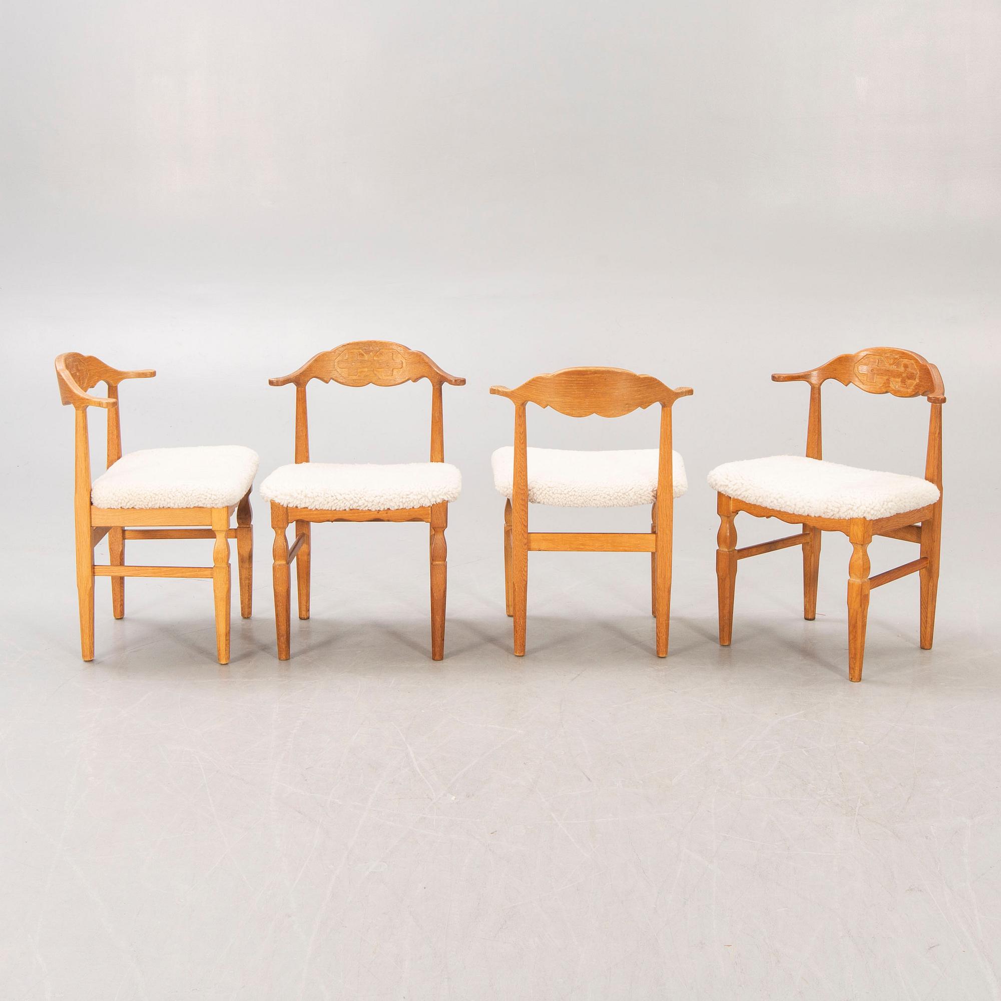 A set of 14 Henning Kjaerulf 1950s oak chairs.