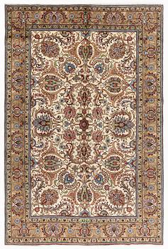 A signed Tabriz carpet, c 309 x 205 cm.