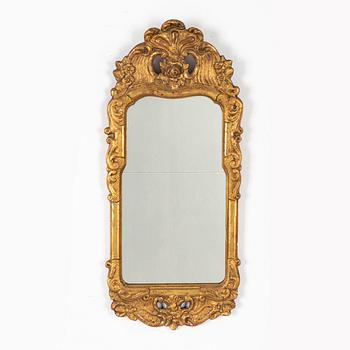 A Rococo mirror, 18th Century.