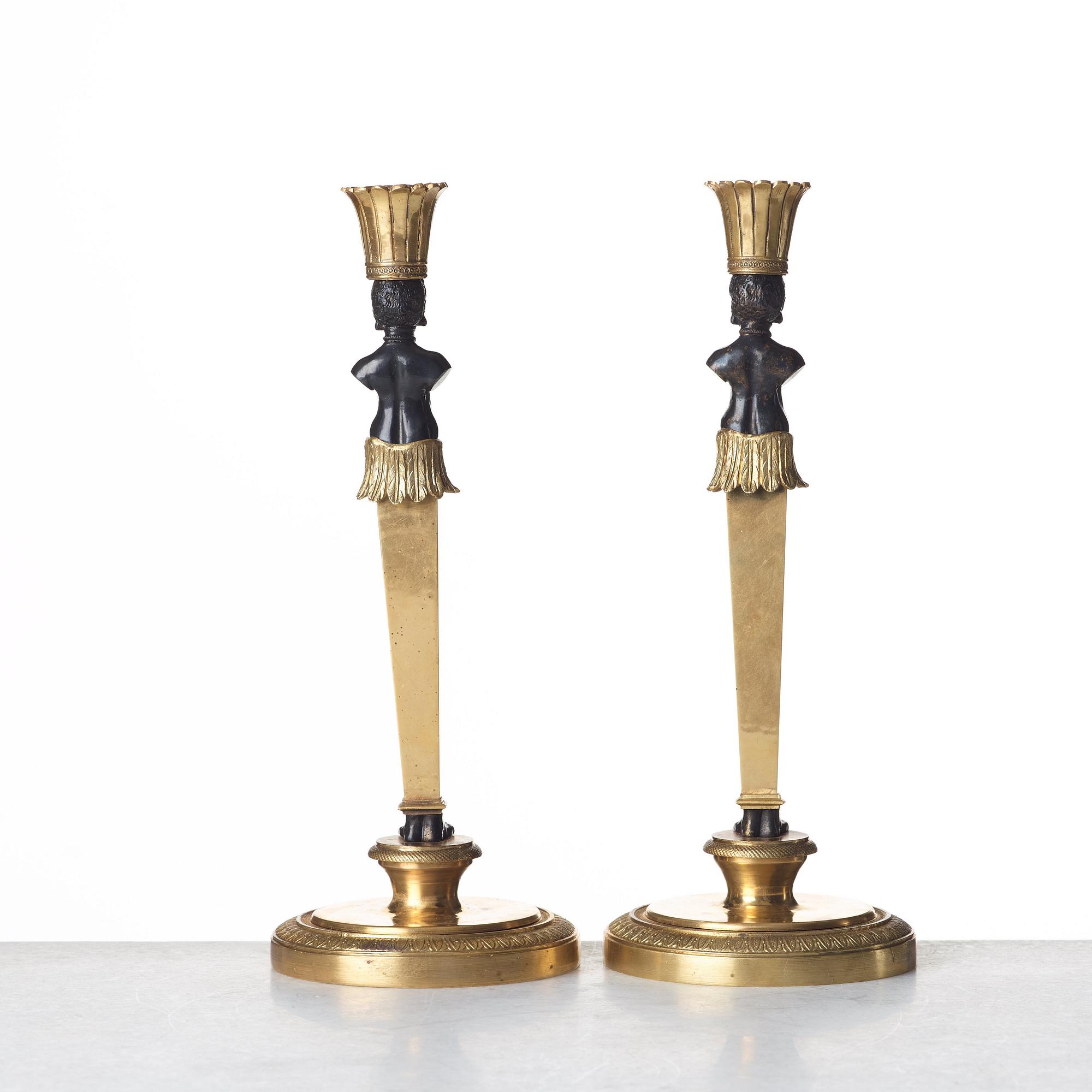 A pair of Empire style candlesticks. Late 19th century.